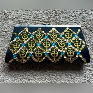 Elegant Black and Gold Clutch with Blue Accents
